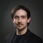 A professional photo of siteLease client London Hillyer in a dark business suit